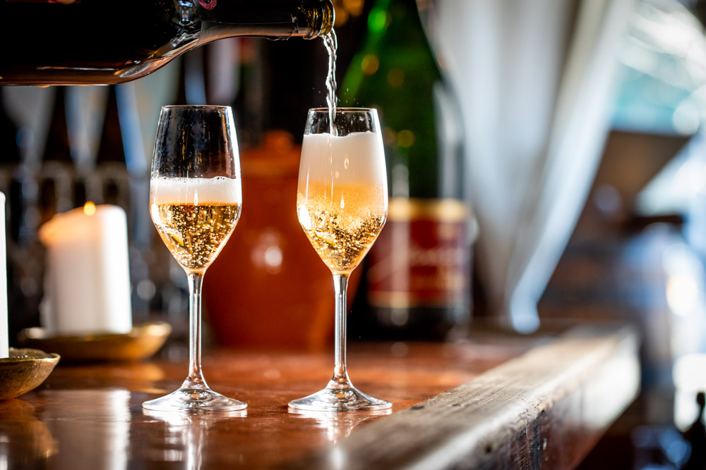 Champaign being poured for a celebration at Convivium Osteria